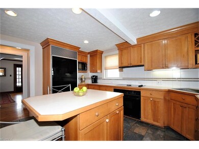 Kitchen with Sub-Zero refrigerator with loads of storage and counter space.