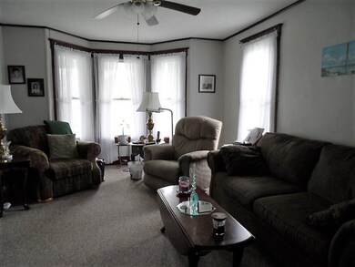 Living Room w Triple Windows