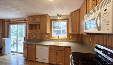 Gorgeous kitchen cabinets; finished wood backsplas