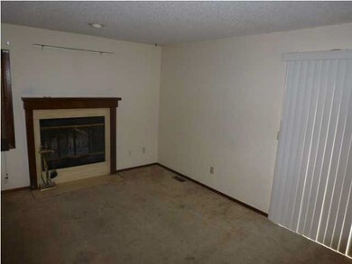 Main floor living/dining room combo with fireplace