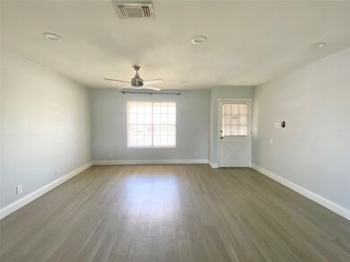 Unfurnished room with ceiling fan, baseboards, an