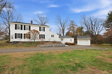 Federal Colonial residence with 2,152sf, 4 Bedrooms, & 1.5 Bathrooms.