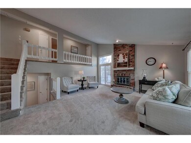 Soaring ceilings with new windows, carpet and pain