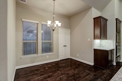 Breakfast area with plenty of space for a large table.  The game room is located on the other side of the double doors.