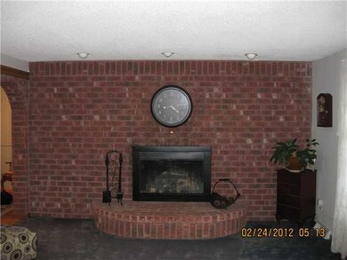 Living Room new rug being installed, gas fireplace