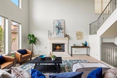 Living room featuring a towering ceiling, plenty 