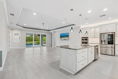 Ready for all recipes: an upgraded chef's kitchen with a KitchenAid double oven, new LG refrigerator, gas cooktop, exhaust fan, soft-close drawers
