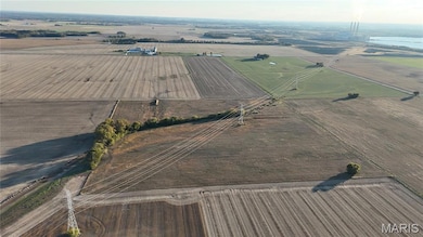 Aerial view of property's location with rural landscape and abundant farmland