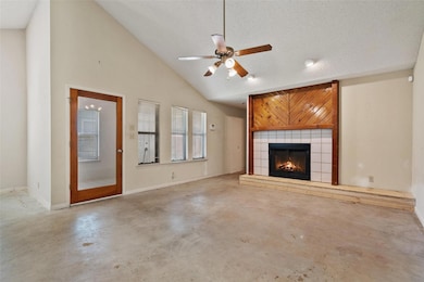 Unfurnished living room featuring finished concre