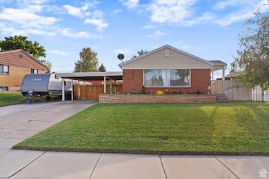 View of front of home featuring driveway and brick siding