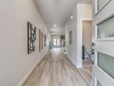 Corridor featuring light hardwood / wood-style flo