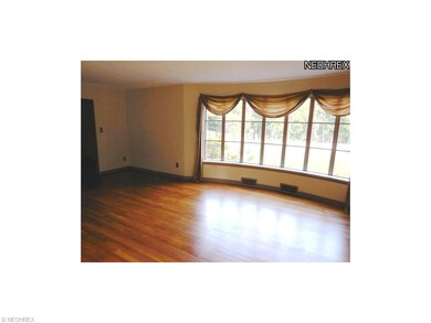 The Living Room's bow window looks out to the golf