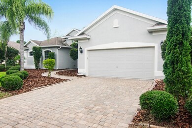 Two car garage with paver driveway
