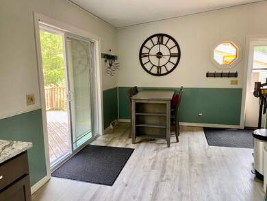 Dining space with light wood-type flooring and ple