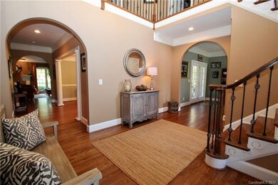 Enter the home into this elegant foyer with wrough