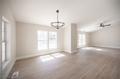 Empty room with visible vents, light wood finished