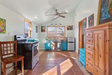 Kitchen area is tiled