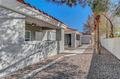 View of yard with a ceiling fan and fence private
