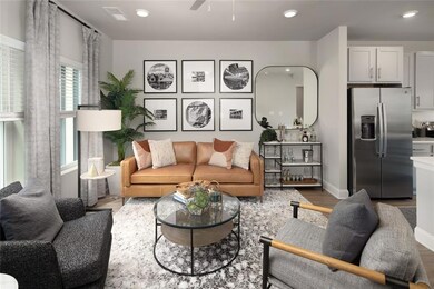 Living room with wood-type flooring and ceiling fa