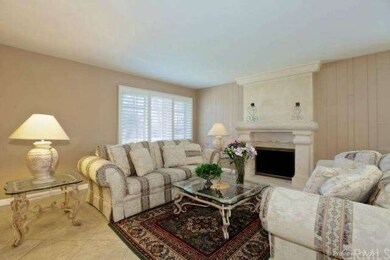 Living room with tiled floors, smooth ceilings, pl