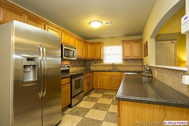 Immaculate Kitchen features newer cabinetry, solid
