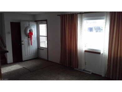 View from dining room to front door, split steps a
