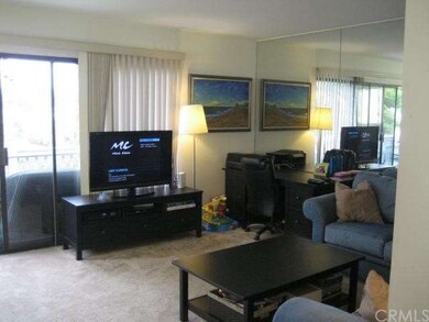Sunny Living Room opens to a spacious deck.
