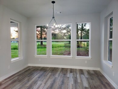 Dining room with large windows overlooking the gol