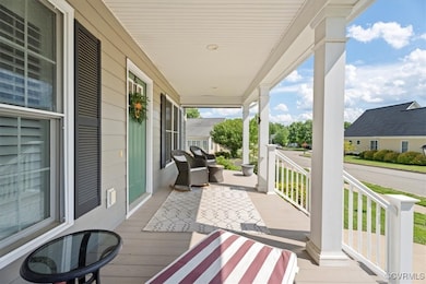 Wooden terrace featuring covered porch