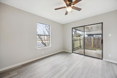 Empty room featuring wood finished floors, basebo