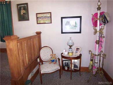 Foyer. Entry area showcases georgous natural woodwork.