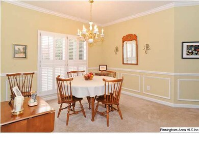 Dining area is all dressed up with wainscoting and