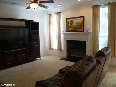 Den/Family/Great Room - Spacious family room with quality carpet perfect for stretching out on the floor.  The gas fireplace is flanked by 6'6