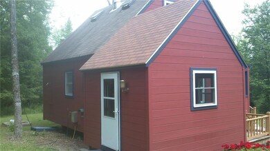 Rear corner standing in the drive-way.