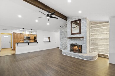 Amazing living room with high ceiling, wood. beam,