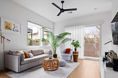 A sun-lit open floor plan welcomes you with tall ceilings and ample natural light. 