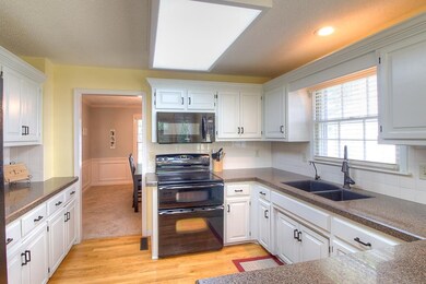 Updated kitchen with granite counter tops and slee