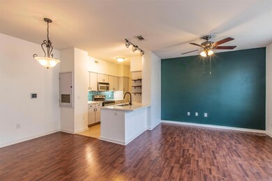 Kitchen featuring backsplash, a sink, wood finish