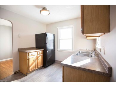 The kitchen features brand new laminate flooring.