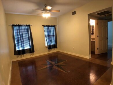 Spare room with baseboards and a ceiling fan