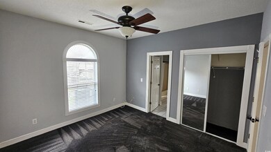 Unfurnished bedroom featuring a textured ceiling, 
