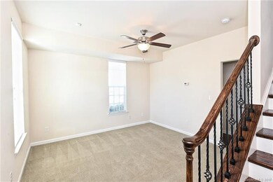 Lower Level Flex Space with Stairs to Living Area