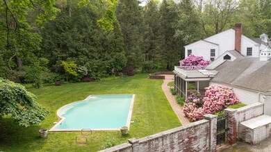 Another view of the pool and back yard