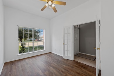 Unfurnished bedroom featuring ceiling fan and light wood-style flooring