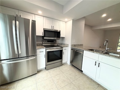 Kitchen with appliances with stainless steel finis