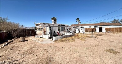 Rear view of house with an outbuilding, a fenced b