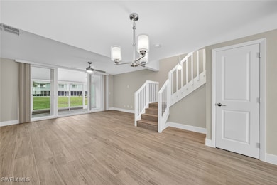 Completely remodeled main floor with new impact glass windows, Luxury vinyl flooring, paint, trim , kitchen, half bath, new light fixtures, a/c, water heater and electric panel.