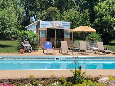 In-ground pool, Tiki Bar & summer in full bloom!