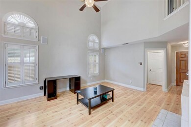 Unfurnished living room with a high ceiling, ceil