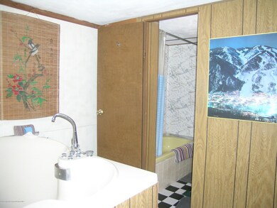 Front Bedroom into Front Bathroom